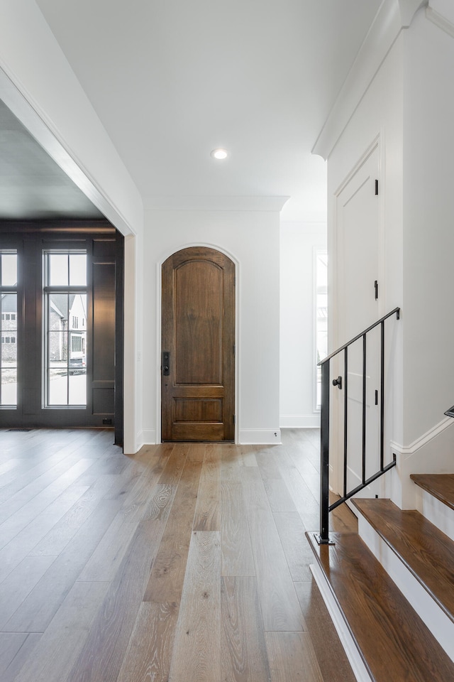 foyer entrance with light hardwood / wood-style floors