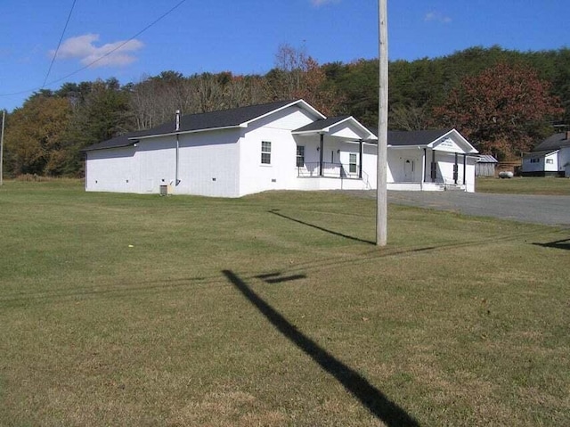 view of front of house with a front lawn and a porch