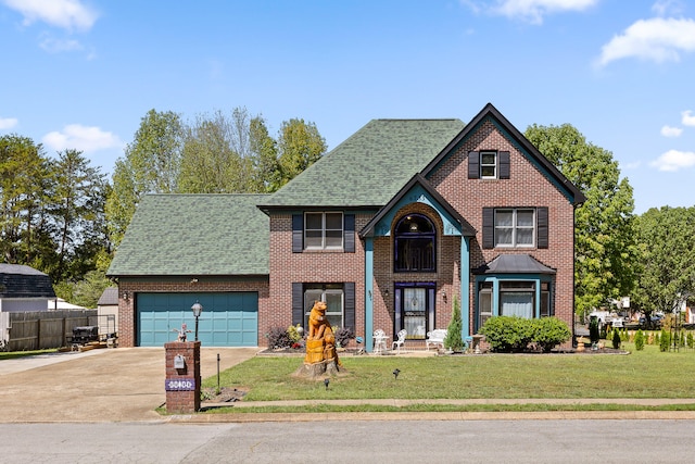 view of front facade featuring a garage and a front lawn