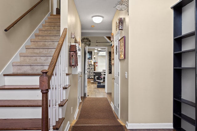 stairway featuring a textured ceiling and hardwood / wood-style flooring