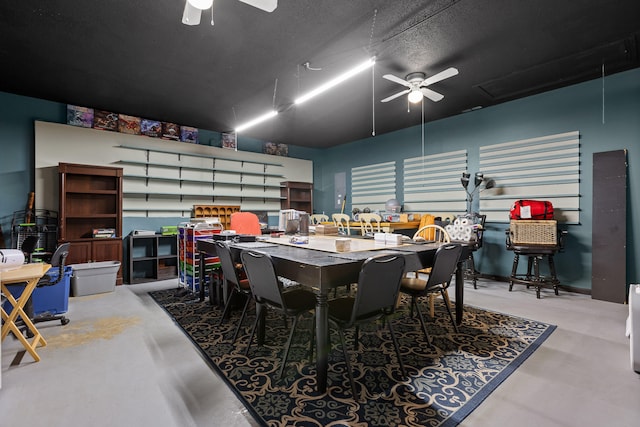 dining space with concrete flooring, a textured ceiling, and ceiling fan