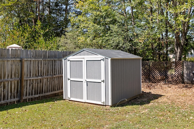 view of outbuilding with a yard