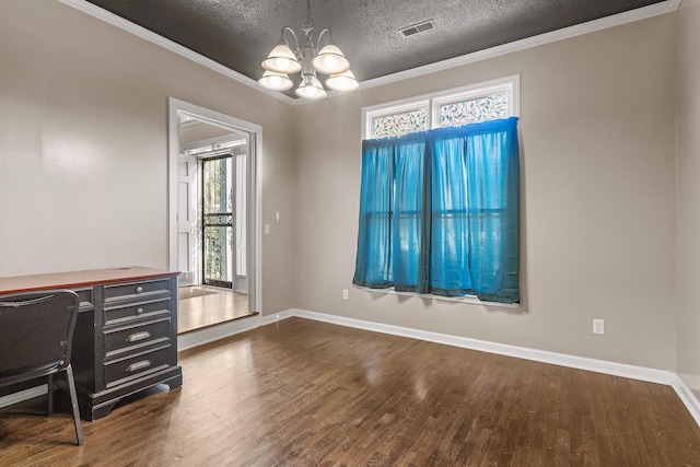 office featuring dark hardwood / wood-style floors, a textured ceiling, a wealth of natural light, and an inviting chandelier