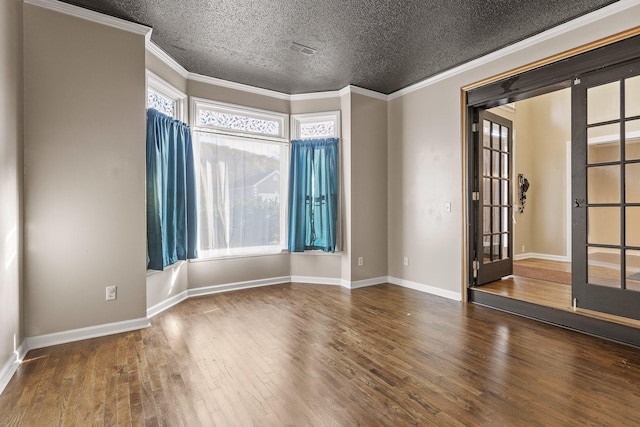 unfurnished room with french doors, a textured ceiling, dark hardwood / wood-style floors, and crown molding