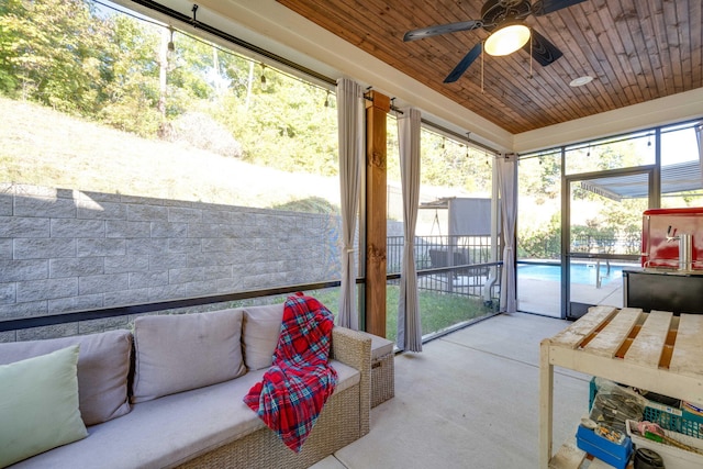 sunroom with wood ceiling, ceiling fan, and plenty of natural light