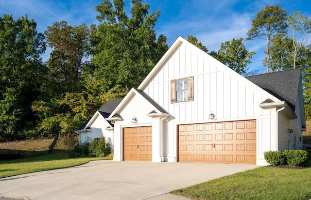 view of front of home with a garage and a front lawn