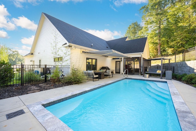 view of pool with a patio and an outdoor hangout area