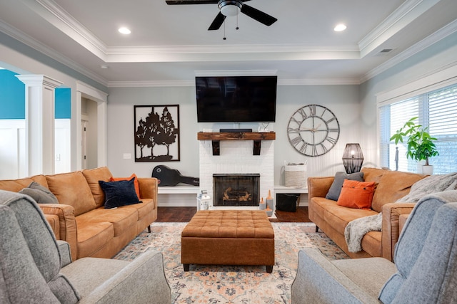 living room featuring ornamental molding, ceiling fan, and hardwood / wood-style flooring