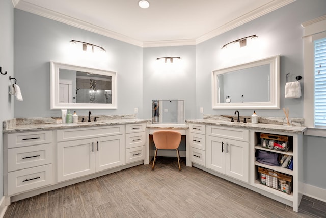 bathroom with vanity, hardwood / wood-style floors, and crown molding