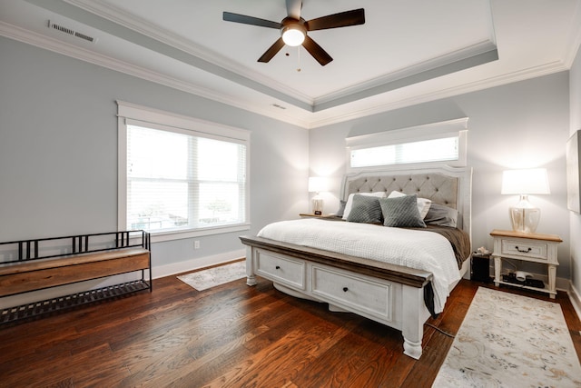 bedroom featuring ceiling fan, crown molding, dark hardwood / wood-style flooring, and multiple windows