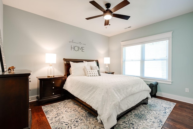 bedroom featuring ceiling fan and dark wood-type flooring