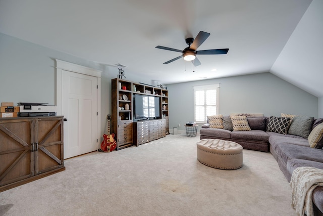 living room featuring vaulted ceiling, ceiling fan, and carpet floors