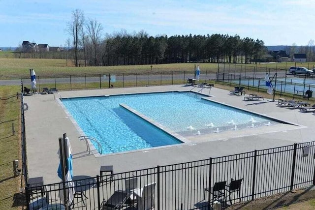 view of swimming pool with a patio area