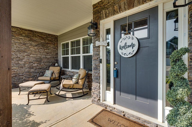 doorway to property featuring covered porch