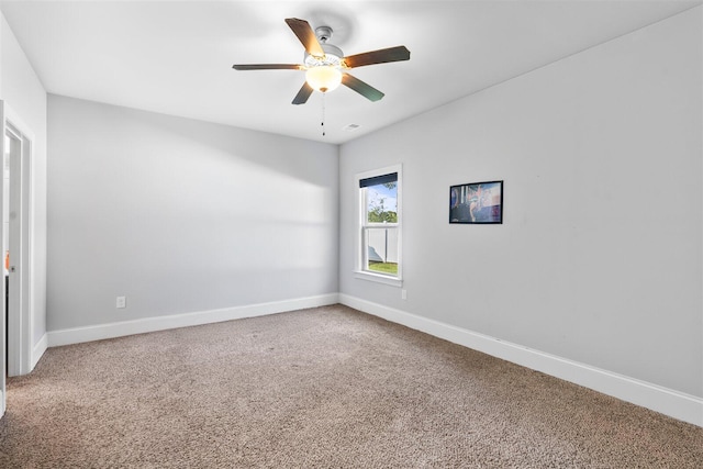 carpeted empty room featuring ceiling fan