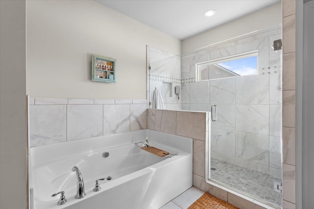 bathroom with plus walk in shower and tile patterned floors