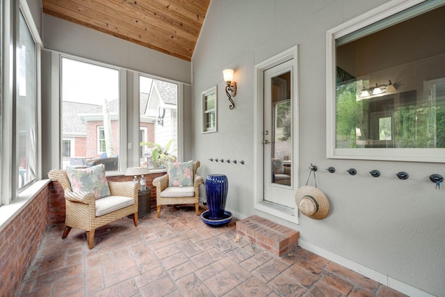 sunroom with lofted ceiling and a wealth of natural light