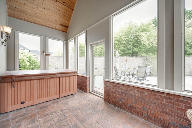 unfurnished sunroom with vaulted ceiling and wooden ceiling