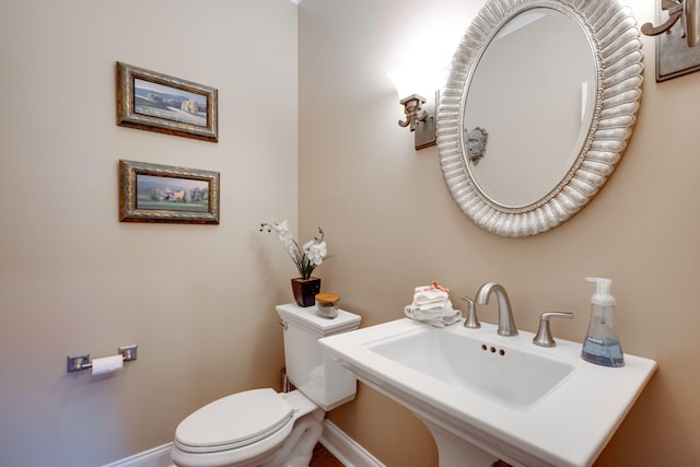 bathroom featuring sink and toilet