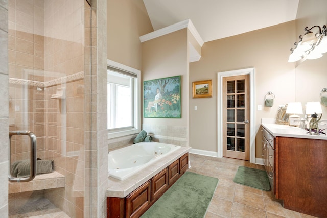 bathroom featuring vaulted ceiling, independent shower and bath, vanity, and tile patterned floors