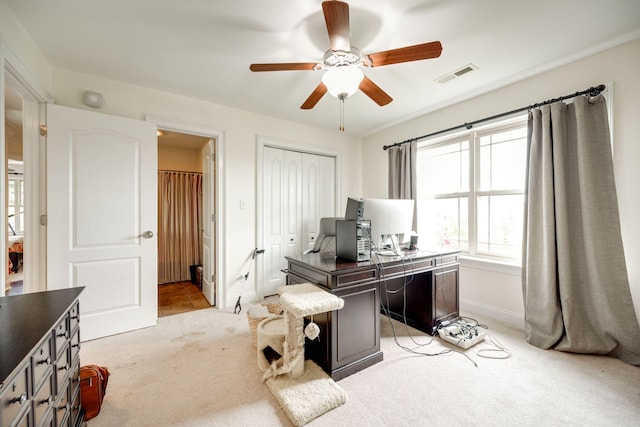 office space featuring ceiling fan and light colored carpet