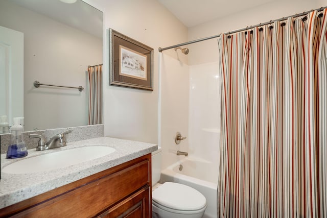 full bathroom featuring vanity, shower / tub combo, and toilet