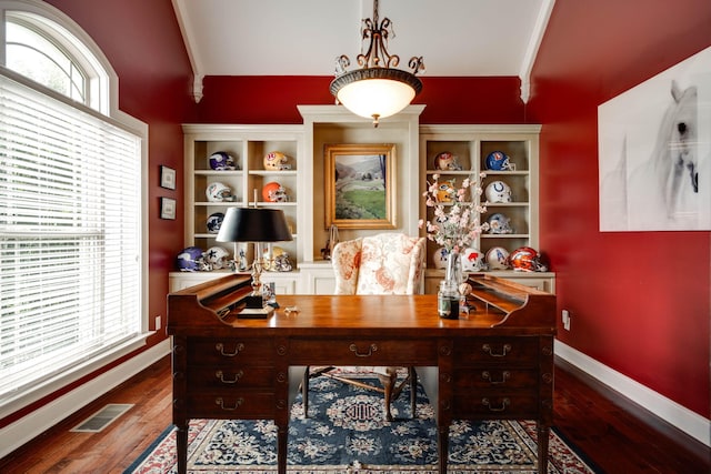 home office featuring ornamental molding and hardwood / wood-style floors