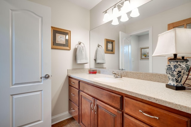 bathroom featuring tile patterned flooring and vanity