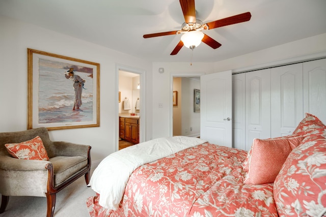 bedroom featuring a closet, ceiling fan, and ensuite bathroom