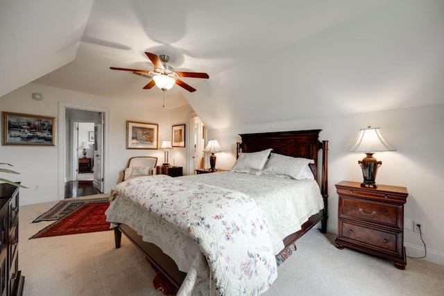 bedroom with light carpet, lofted ceiling, and ceiling fan