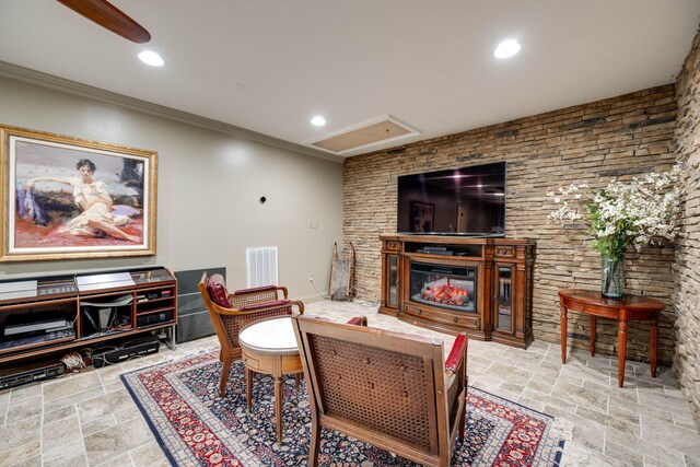 153 Thorncrest Dr, Ringgold, GA 30736 - living area with a glass covered fireplace, stone tile flooring, ornamental molding, recessed lighting, and attic access