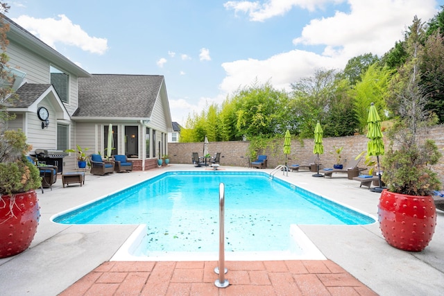 view of pool featuring an outdoor living space and a patio area