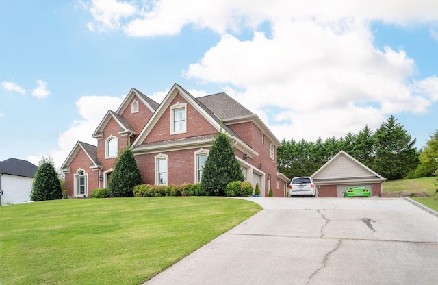 153 Thorncrest Dr, Ringgold, GA 30736 - view of front facade with brick siding, a front yard, and a garage