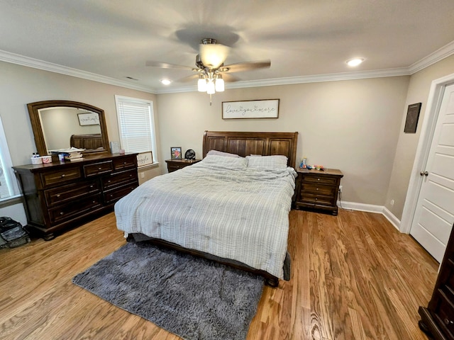 bedroom featuring crown molding, multiple windows, light wood-type flooring, and ceiling fan