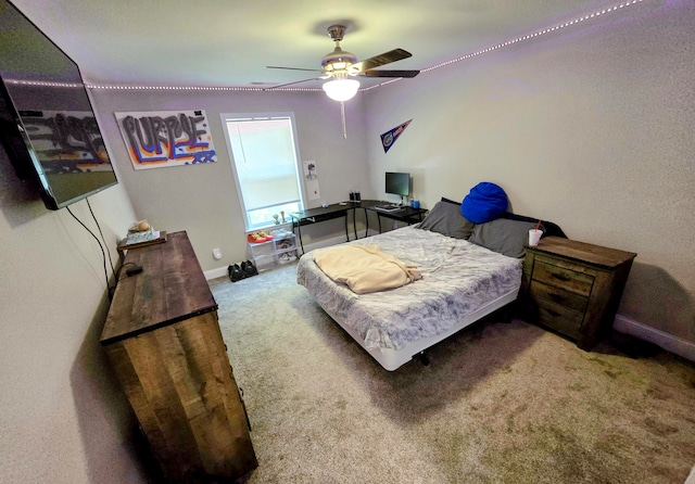 bedroom with ceiling fan and carpet floors