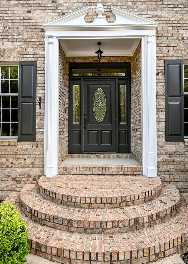 entrance to property featuring a porch