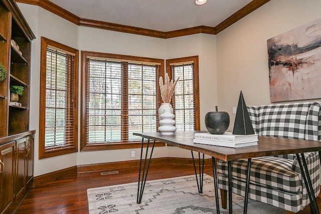 office area with ornamental molding, dark wood-style flooring, visible vents, and baseboards