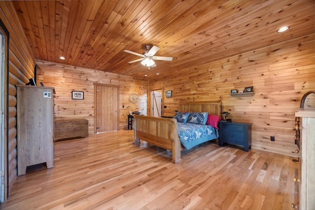 bedroom with light wood finished floors, recessed lighting, and wood ceiling