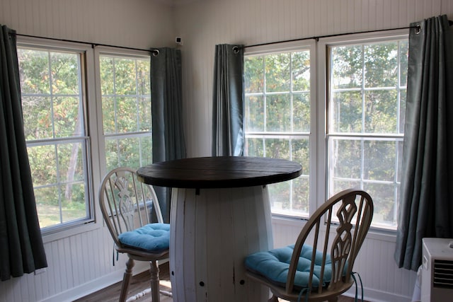 dining space featuring hardwood / wood-style flooring and a healthy amount of sunlight