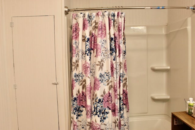 bathroom featuring shower / bath combination with curtain