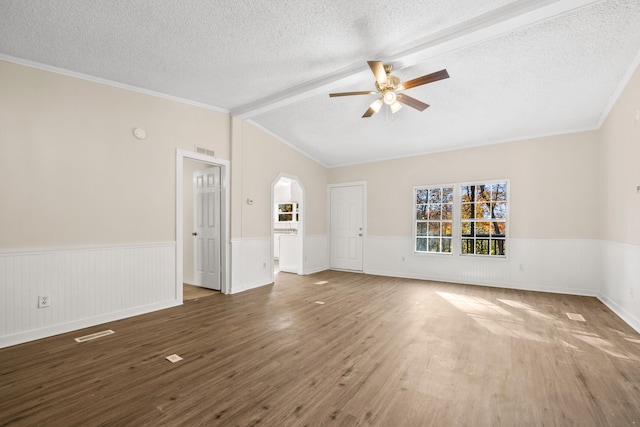 unfurnished living room with crown molding, dark hardwood / wood-style floors, a textured ceiling, and ceiling fan