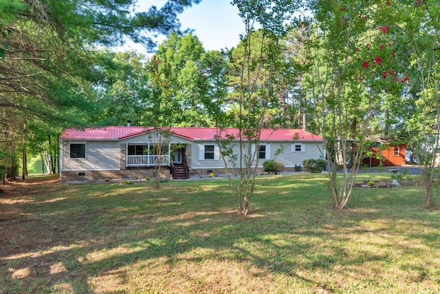 exterior space featuring a yard and covered porch