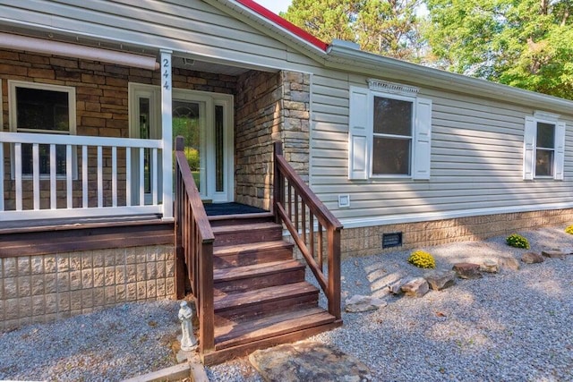 property entrance with covered porch