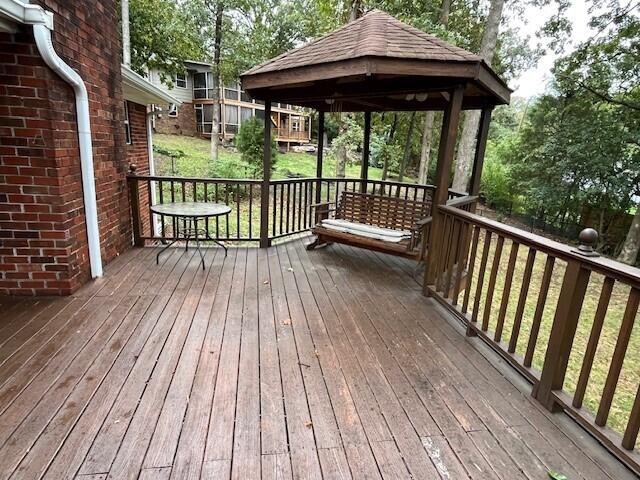 wooden terrace with a gazebo