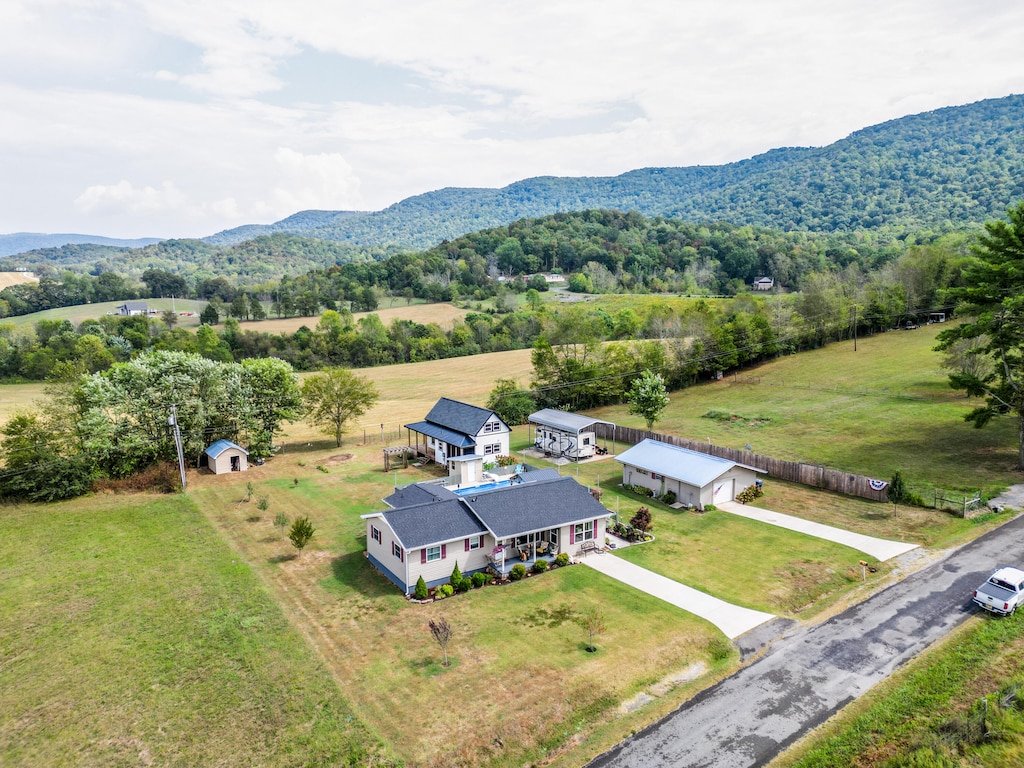 birds eye view of property featuring a rural view and a mountain view