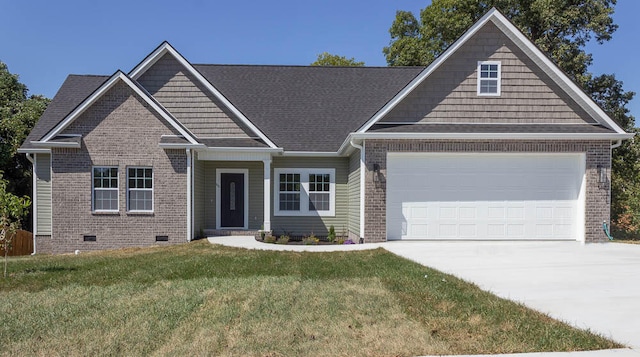 craftsman inspired home featuring a front yard and a garage