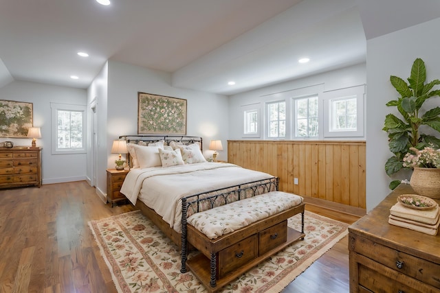 bedroom featuring multiple windows and hardwood / wood-style floors