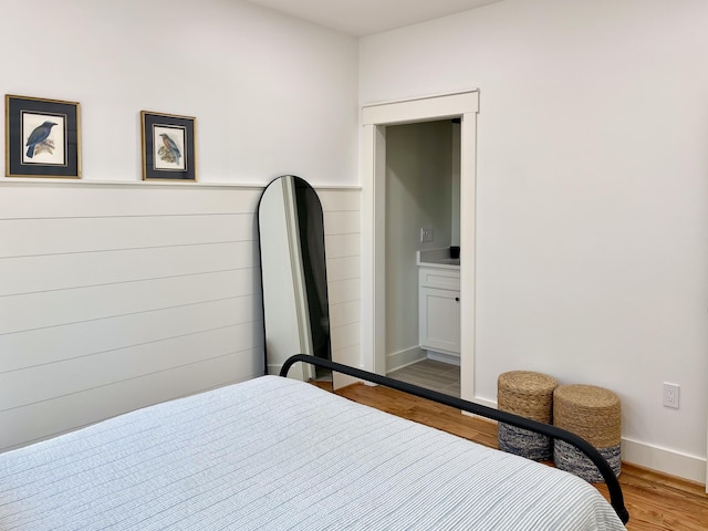 bedroom with hardwood / wood-style flooring