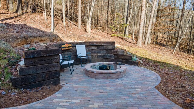 view of patio with a fire pit