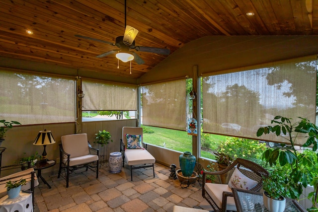 sunroom / solarium featuring lofted ceiling, wood ceiling, and ceiling fan